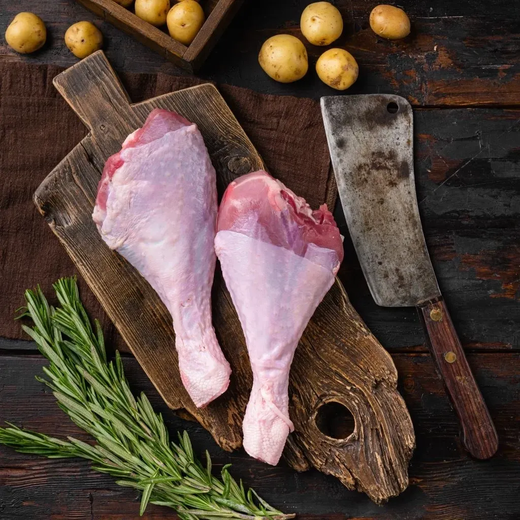 Turkey-Drumsticks-raw-Wood-Board-Chopper-SQ-Website.jpg